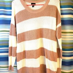 A cream and beige sweater